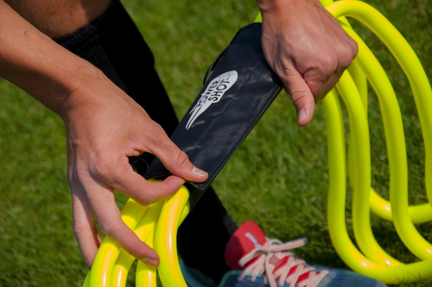 Carrying handle for hurdles and slalom poles